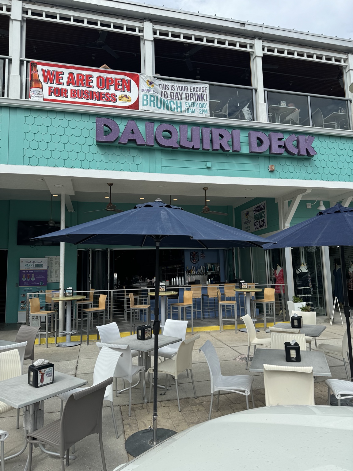 Outdoor tables beneath the Daiquiri Deck sign at St. Armands Circle