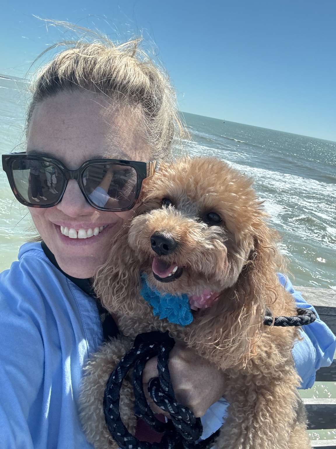 Mary Beth Cooper holding Stella beside the water